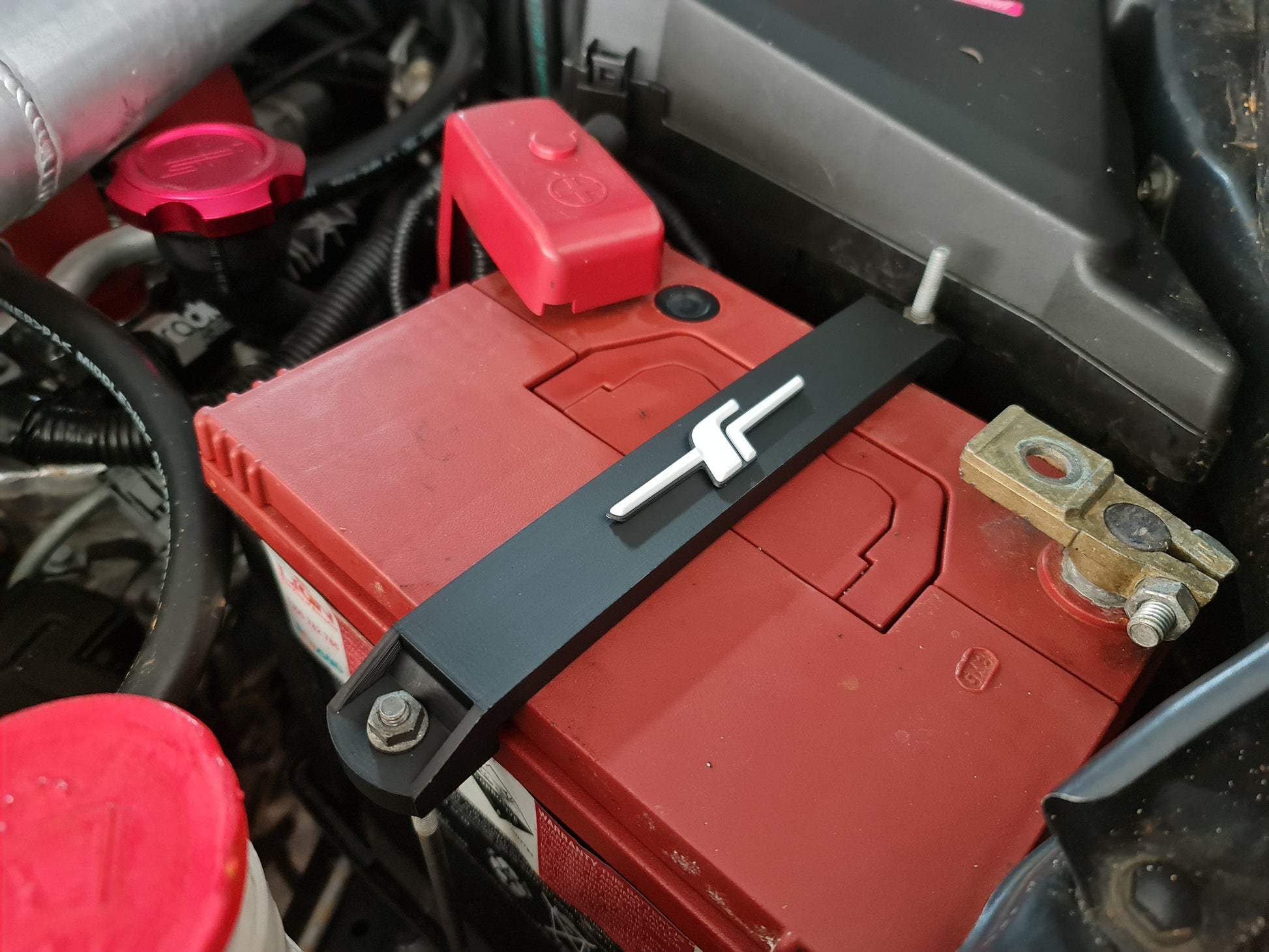Subaru battery tie down image 5